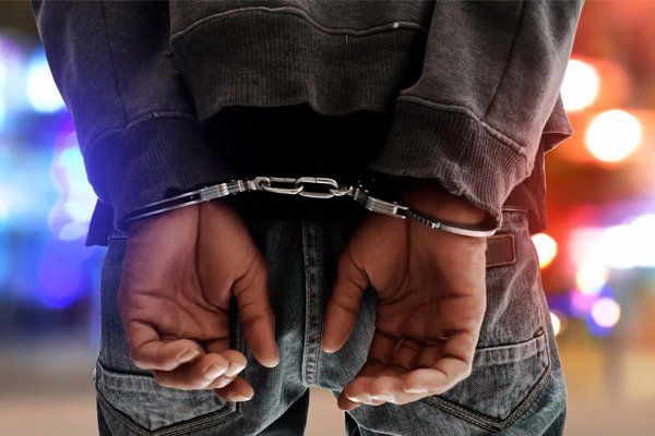 Man in Handcuffs — Fresno, CA — Law Office of Ralph Torres Man in Handcuffs — Fresno, CA — Law Office of Ralph Torres