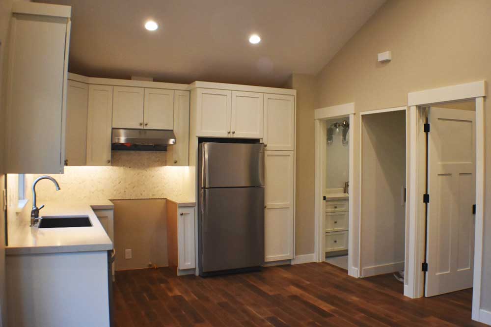 Kitchen remodeling design with white shaker custom cabinets and stainless steel appliances