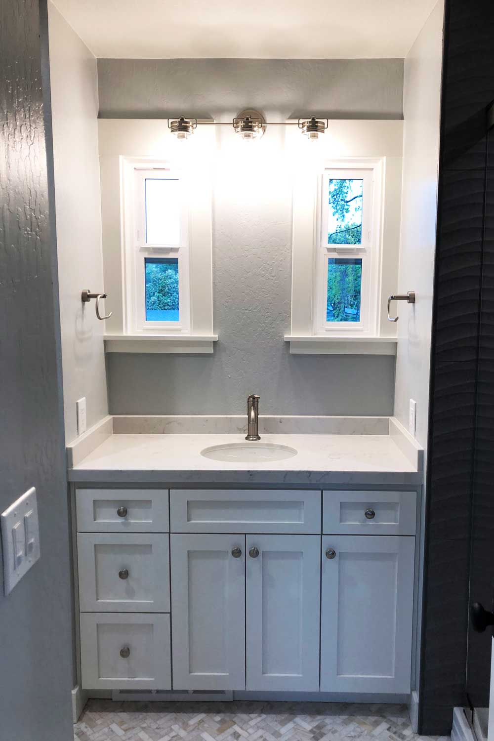 Custom single sink vanity with quartz counter top