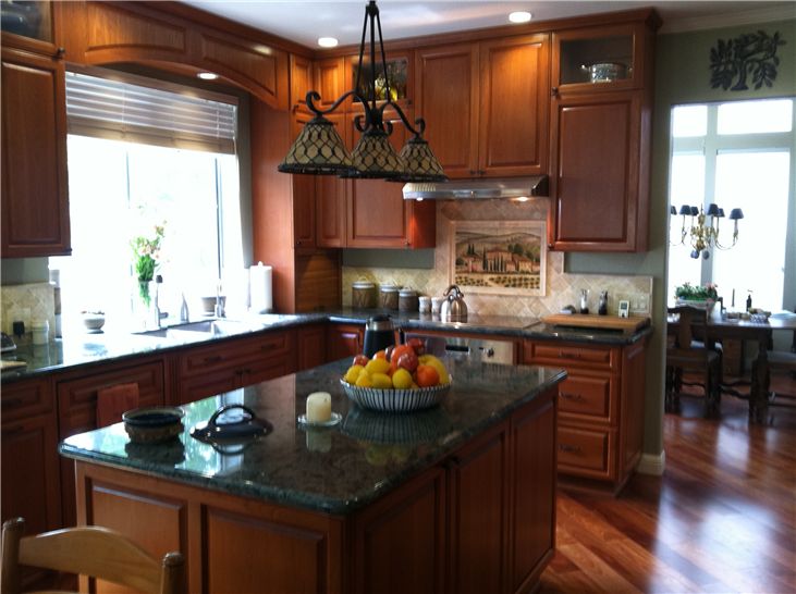 Interior kitchen with stained wood custom cabinets
