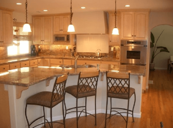 Kitchen remodeling project with breakfast bar counter top and custom cabinets