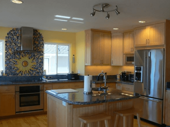Full-scale kitchen remodeling project with custom cabinets and custom tile work for mosaic