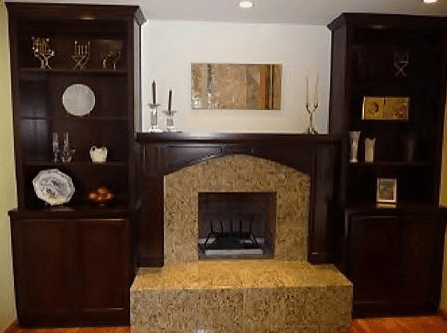 fireplace mantle next to china cabinet