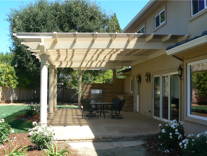 Outdoor pergola with columns and custom stone patio