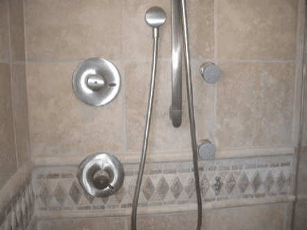 Close up of custom stone finish for the interior of a shower enclosure in Santa Clara, CA
