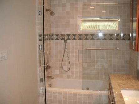 Interior of a shower enclosure with custom tile work walls