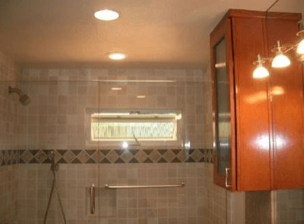 Custom cabinets hanging outside shower enclosure