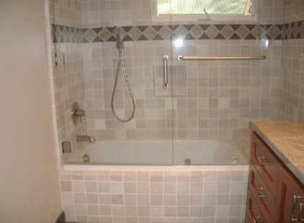 Interior of a shower enclosure with custom tile work walls