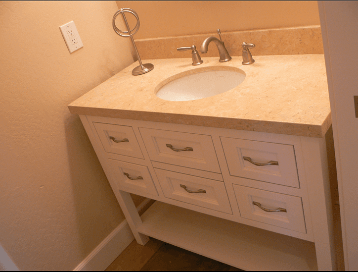 White custom cabinets for a bathroom vanity with a light quartz counter top