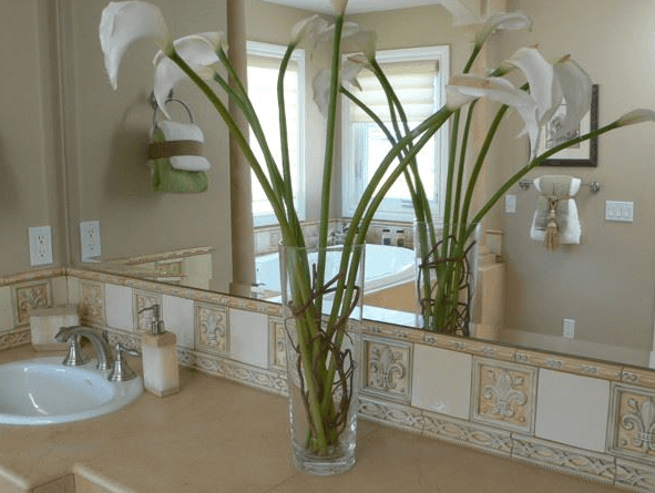 Close up photo of custom tile work design border for bathroom vanity