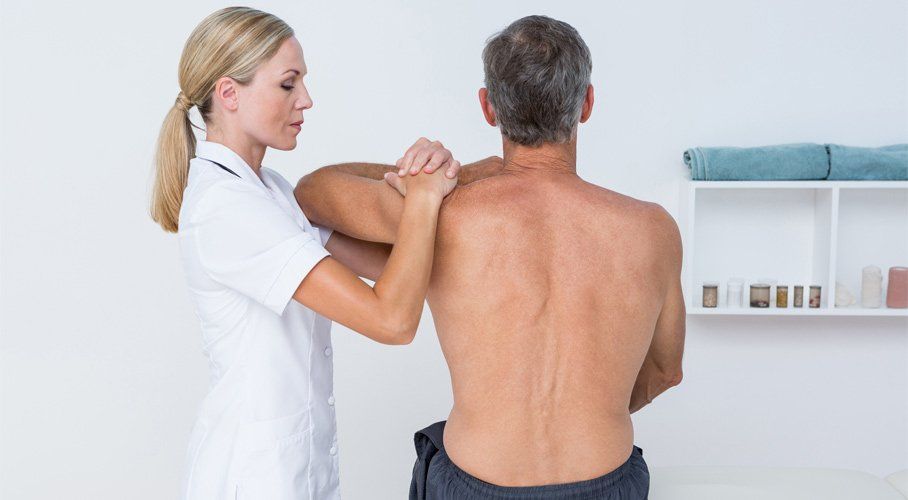 doctor examining her patient shoulder macquarie osteopaths doctor examining her patient shoulder