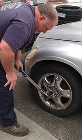 Man Repairing Tire - Tire Repair in Northampton, MA Man Repairing Tire - Tire Repair in Northampton, MA