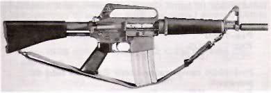 A black and silver rifle with a sling, likely an M16 variant.