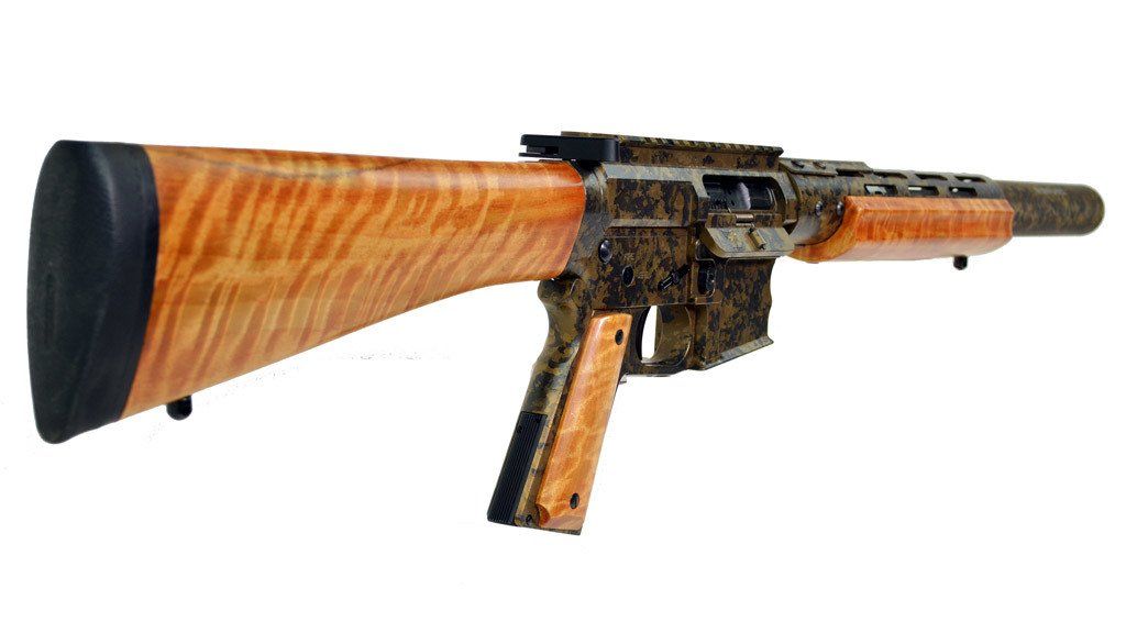 Rifle with wood grain stock and handguard, camouflage body.