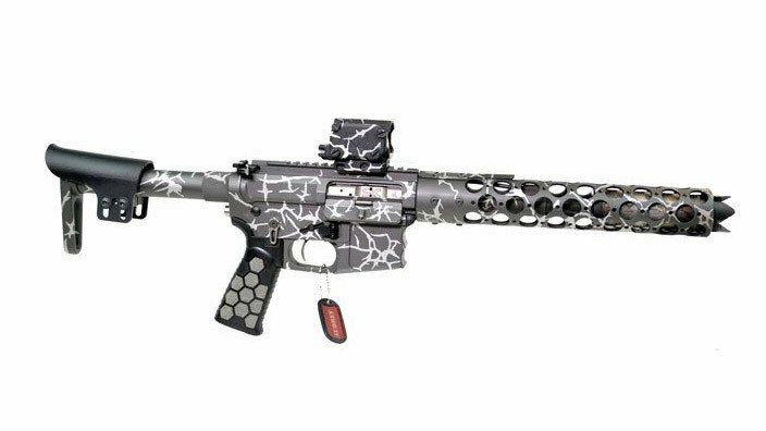 Gray rifle with lightning pattern camo, red tag hanging.