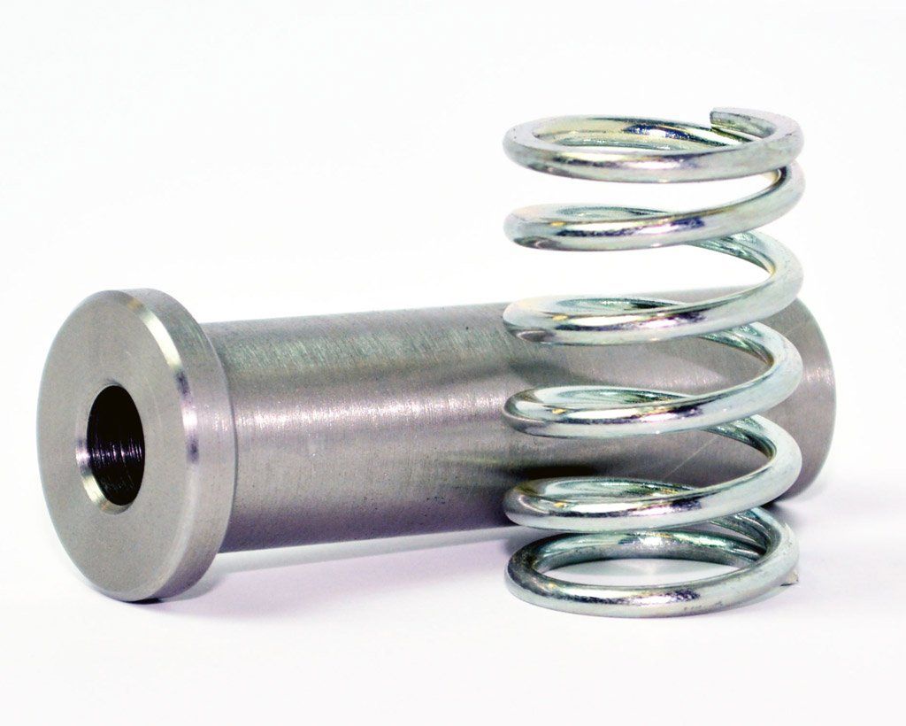 A metal pin with a flared end, a central hole, and a silver coil spring.