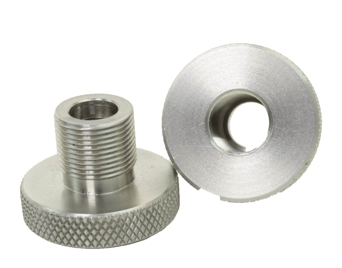 Two metallic adapters with threaded posts and knurled bases. One has a central hole.