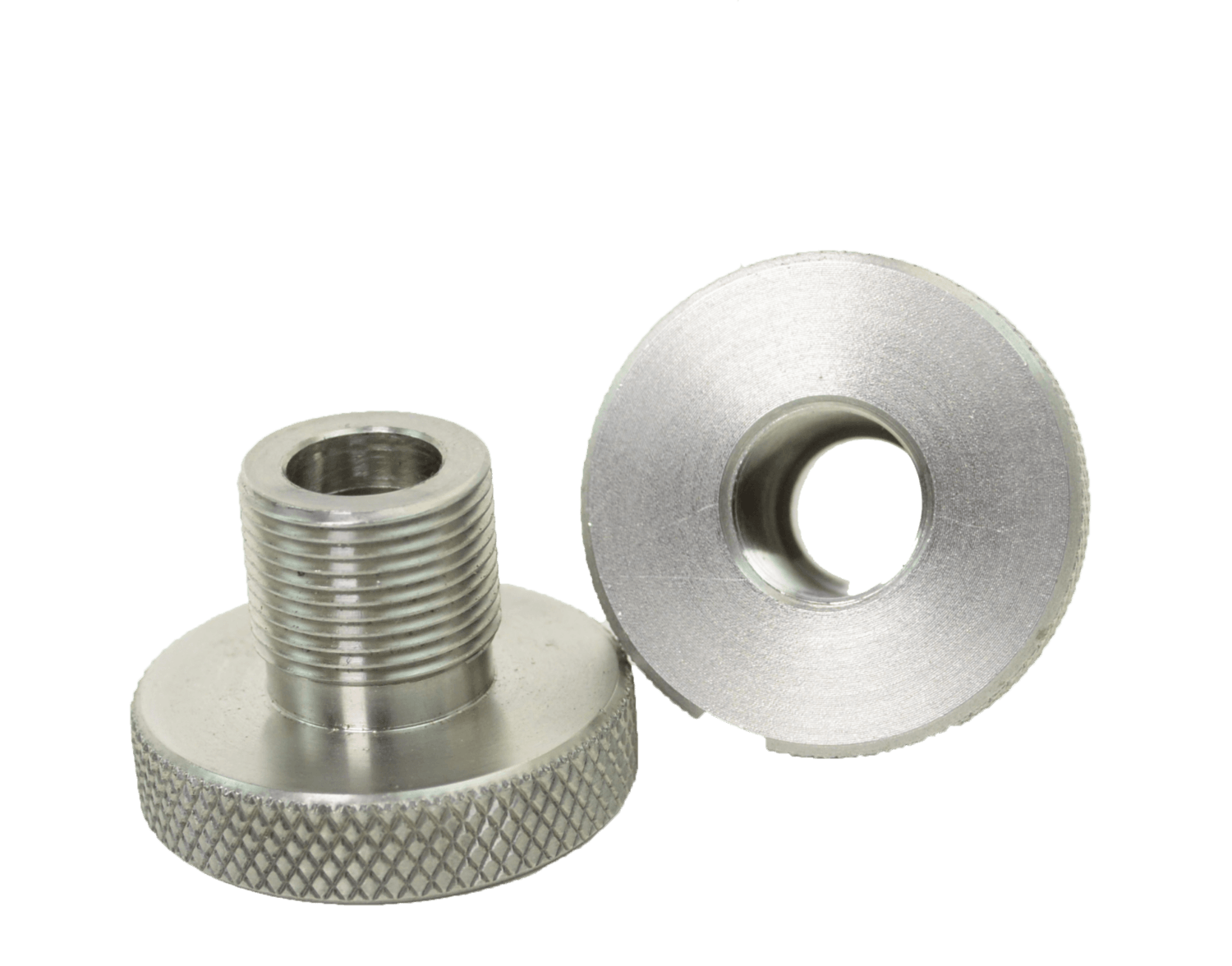 Two metallic adapters; one threaded, and one with a large opening.