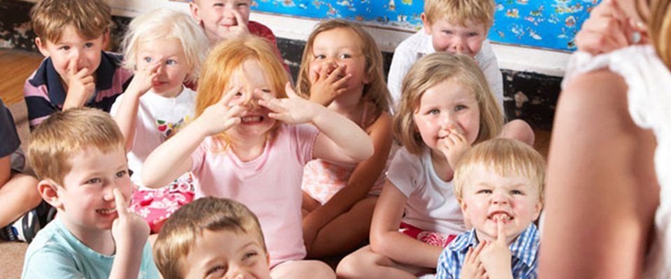 Kids listening to their teacher