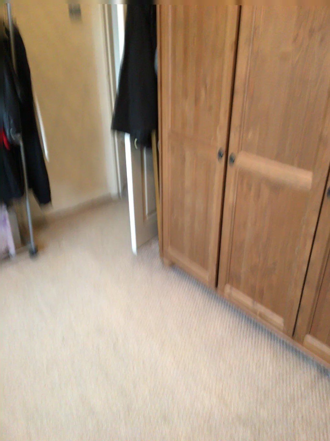 Spare bedroom floor space cleared and closed wardrobe