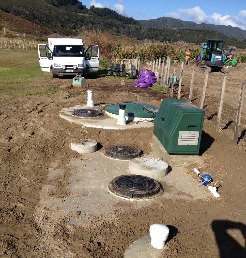 Plumber working on drainlaying in a bathroom