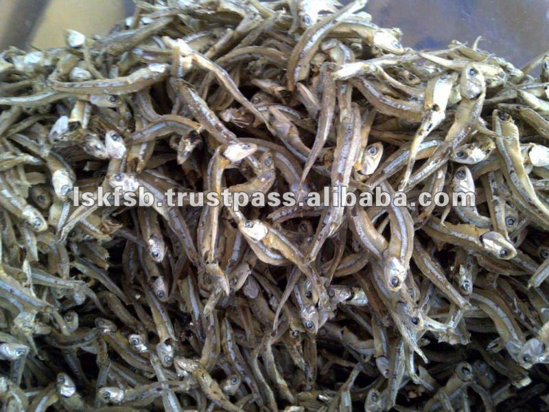 Dried anchovies, small silver fish in a pile.