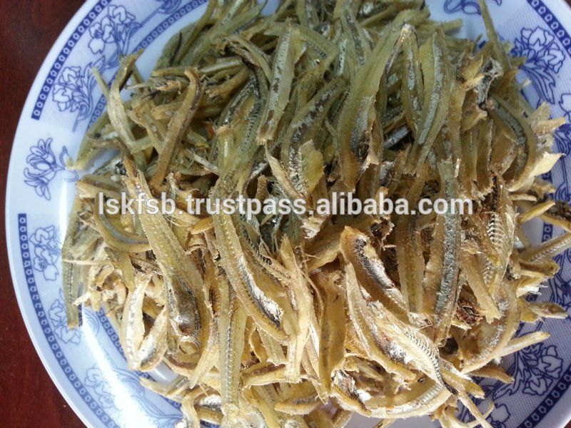 Dried anchovies on a white and blue patterned plate.