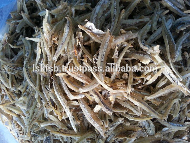 Dried anchovies, small silver fish, piled in a heap.