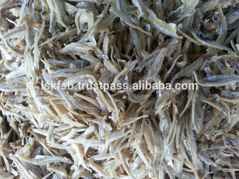 Pile of dried, small fish, likely anchovies, in a close-up view.