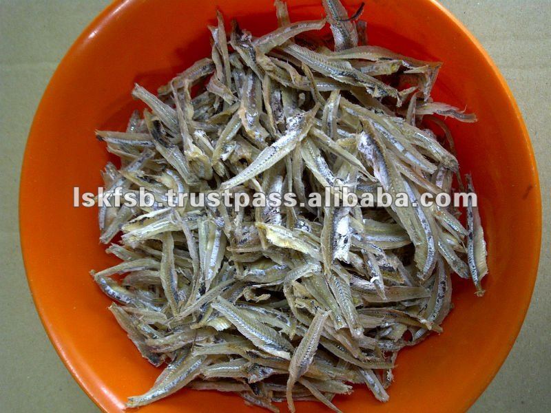 Dried anchovies in an orange bowl.