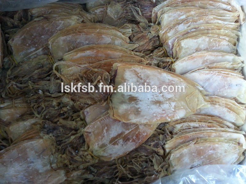 Dried squid in a box, light brown and white with a slightly rough texture.