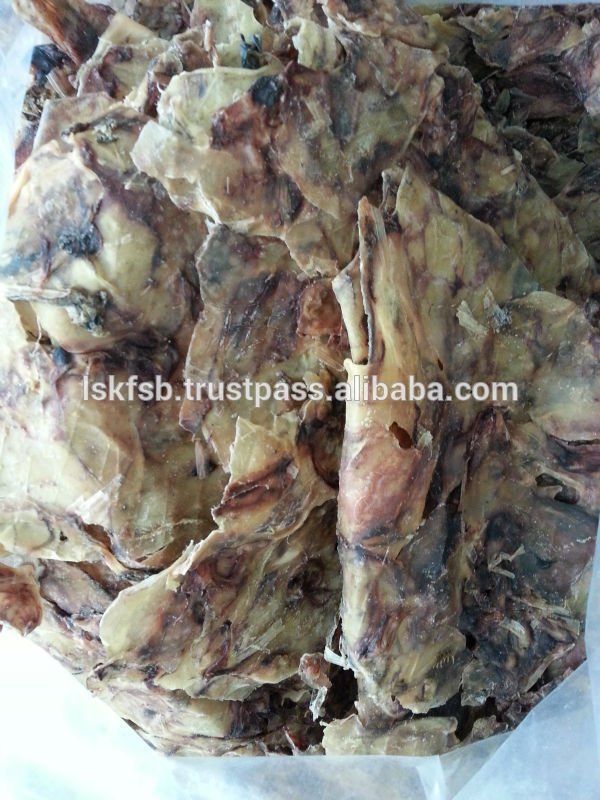 Dried squid pieces, light brown and white, piled together.