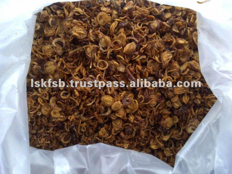 Dried, fried onions in a clear plastic bag; a food product, brown color.