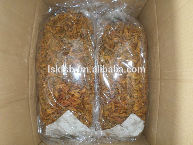 Two large bags of dried, brown tobacco inside a cardboard box.
