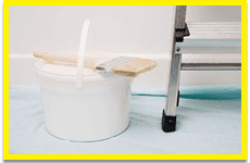 Paint pot at the bottom of some ladders
