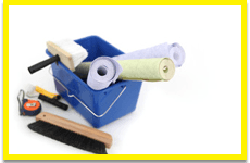 Wallpaper and pasting brush in a blue bucket