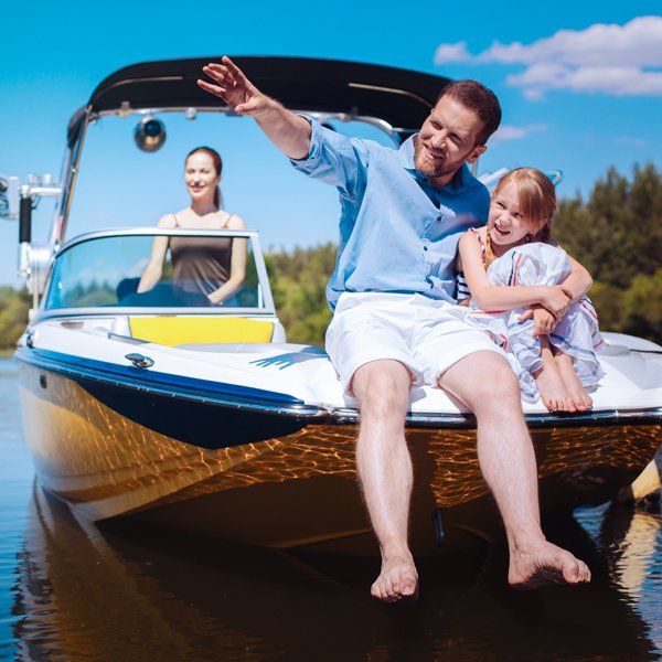 Family In A Boat — Woodland, CA — Jack Cramer Insurance Family In A Boat — Woodland, CA — Jack Cramer Insurance