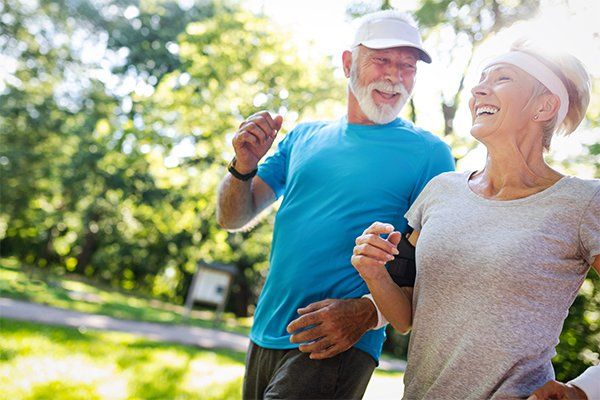 Mature Couple Jogging — Woodland, CA — Jack Cramer Insurance Mature Couple Jogging — Woodland, CA — Jack Cramer Insurance