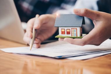 Lawyer Holding a Small House — Shelby, NC — Deaton & Biggers, PLLC