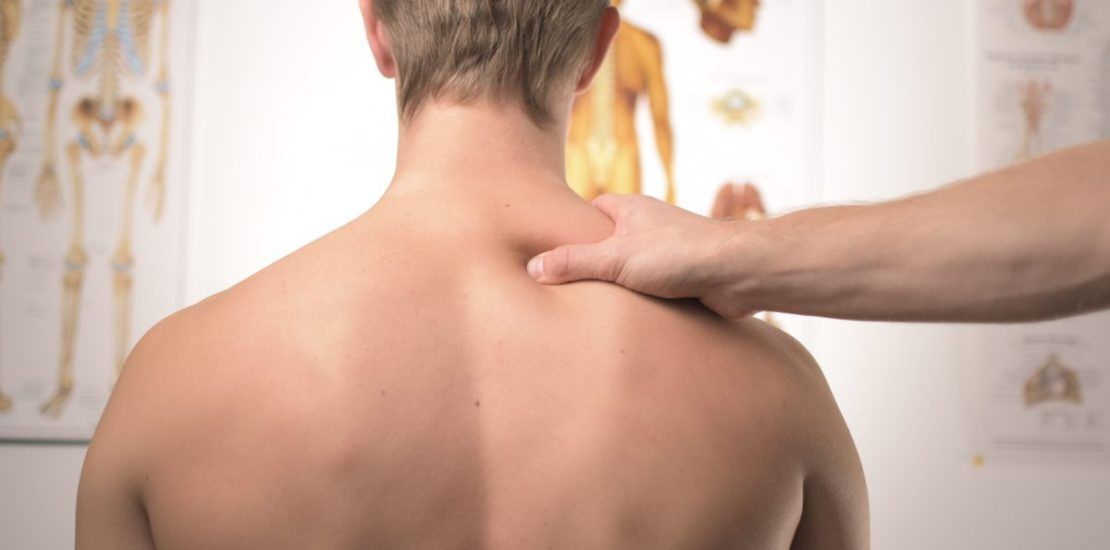 A man is getting a massage on his back.