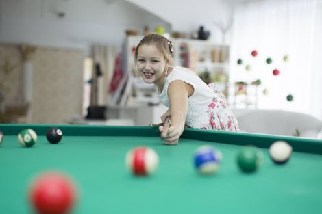 girl playing pool at home girl playing pool at home