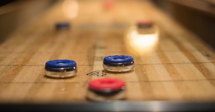 close up of shuffleboard table close up of shuffleboard table