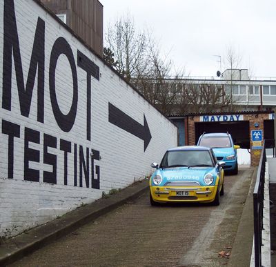 mayday motors ramp acces with mot painted on the wall