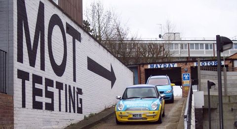 mayday motors ramp acces with mot painted on the wall