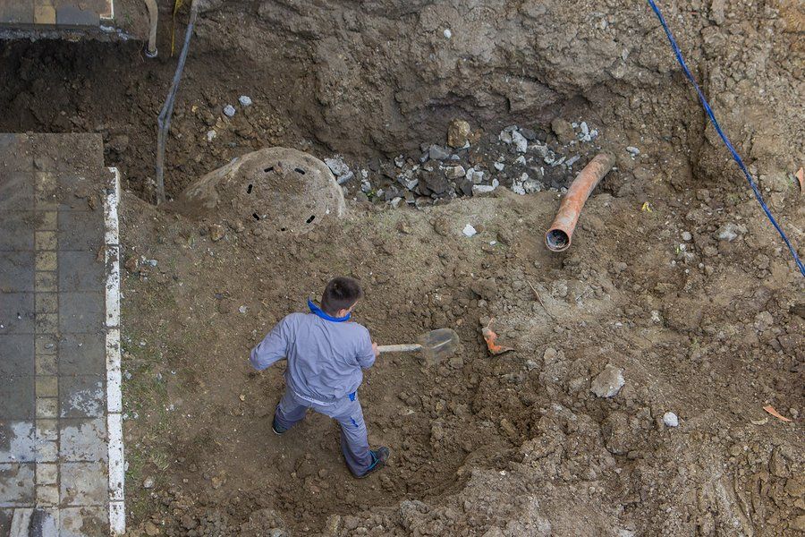 man doing excavation for septic