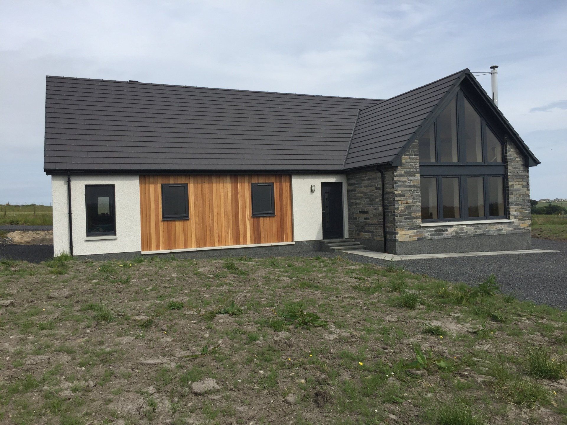 New kit house front with wood panelling
