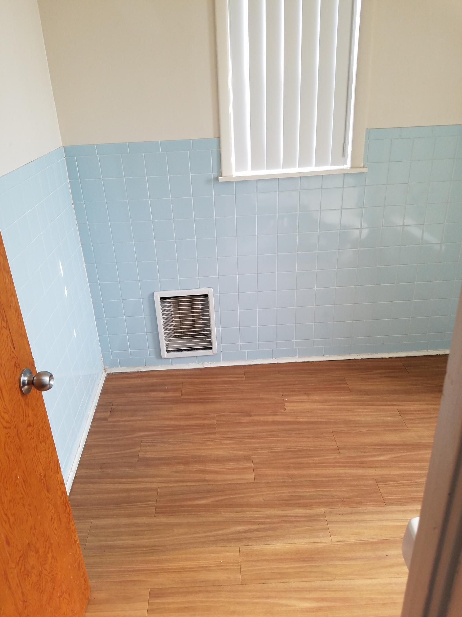 Interior of room with window and light blue walls