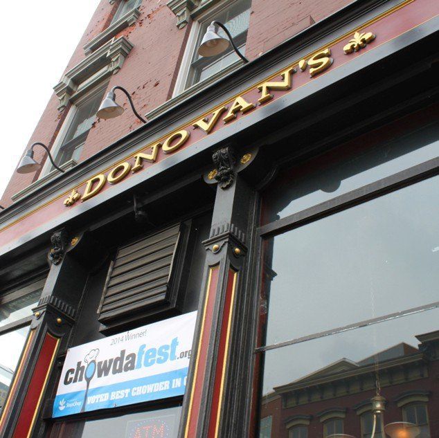 The exterior of Donovan’s restaurant featuring a blue Chowdafest banner hanging above the entrance.