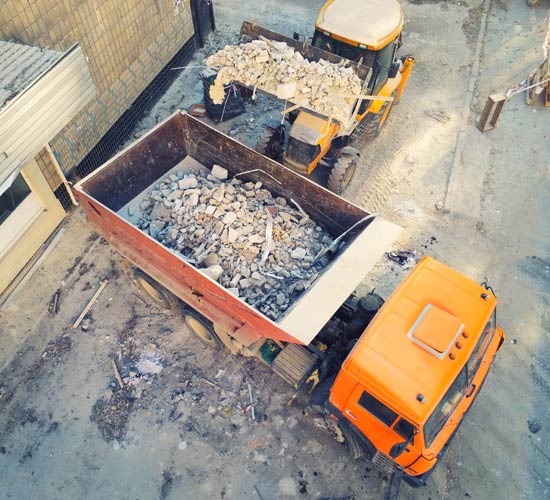 Truck Carrying Broken Cement — Jackson, MS — Tri-Miss Services, Inc. Truck Carrying Broken Cement — Jackson, MS — Tri-Miss Services, Inc.