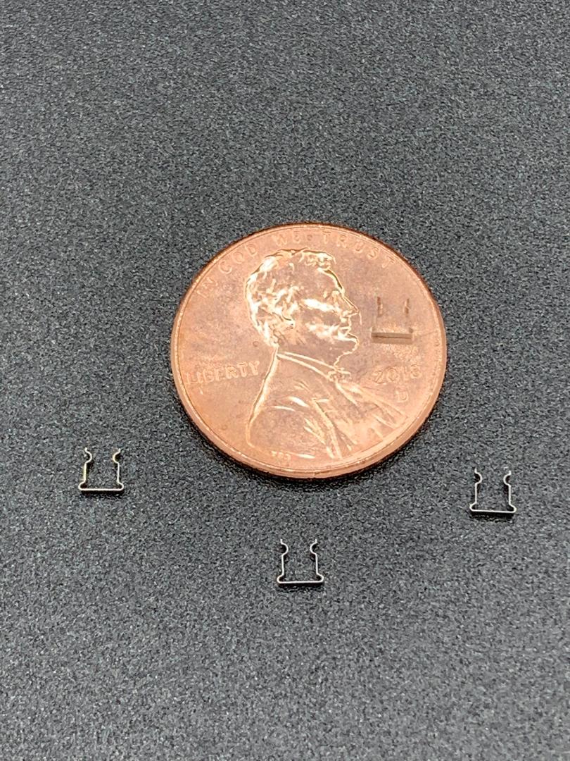 A close up of a penny on a table.